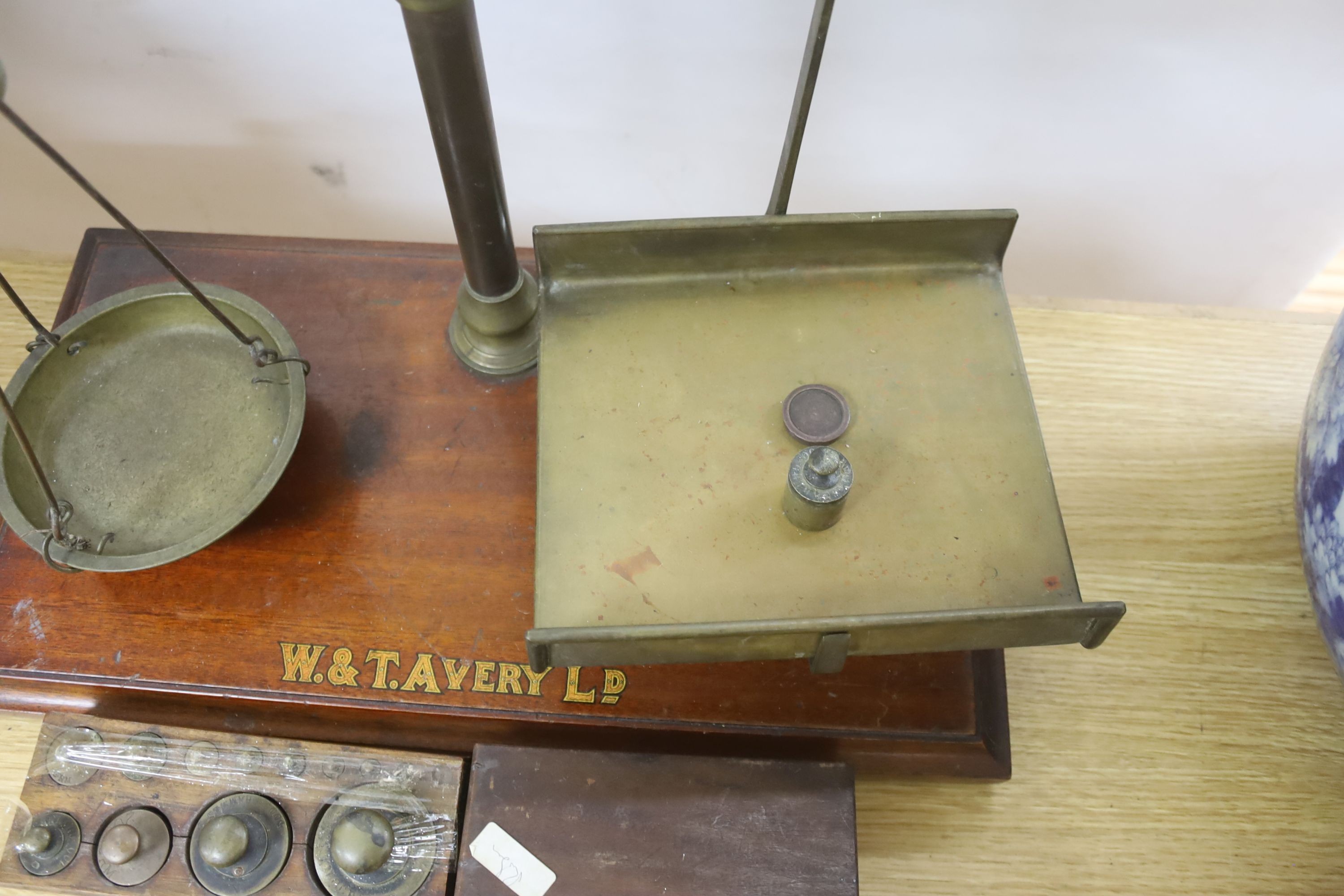 A large W.&T.Avery brass beam scales with weights, 59cm